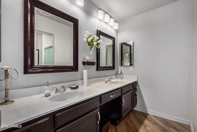 bathroom with vanity and hardwood / wood-style floors