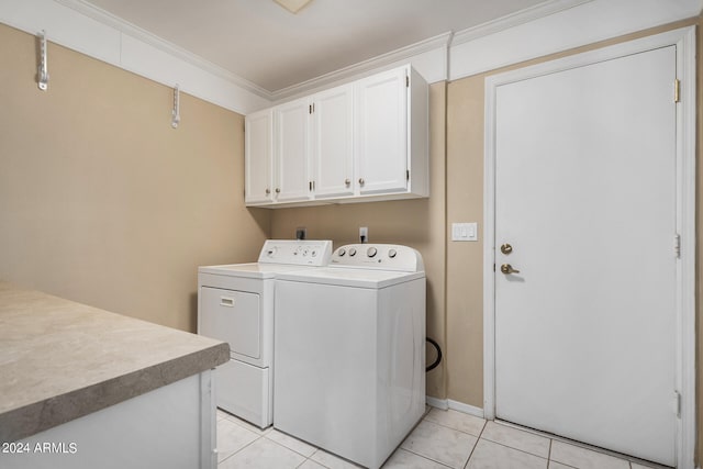 laundry room with cabinets, light tile patterned floors, independent washer and dryer, and ornamental molding