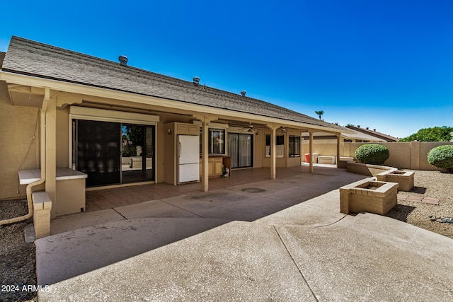 rear view of property featuring a patio area