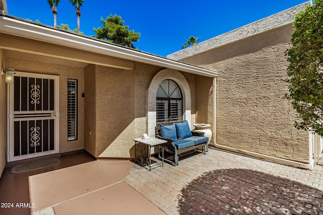 property entrance with a patio area