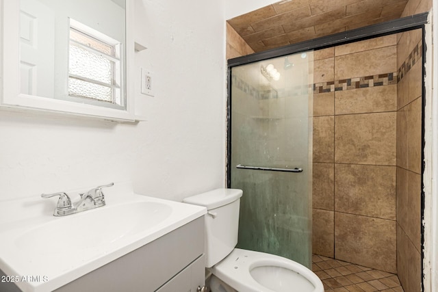 full bath with toilet, a stall shower, and vanity