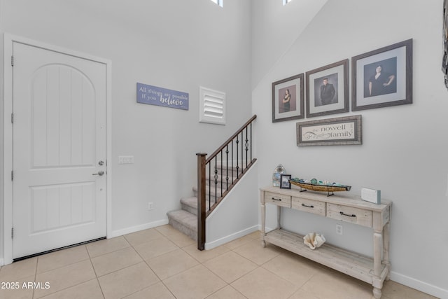 foyer entrance featuring light tile patterned floors