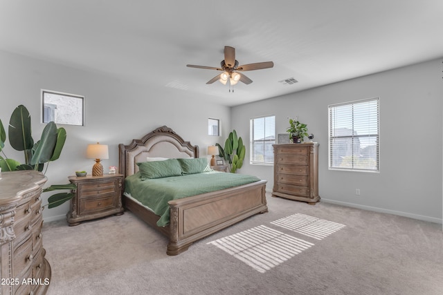 bedroom featuring light colored carpet and ceiling fan