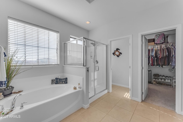 bathroom with tile patterned flooring and independent shower and bath