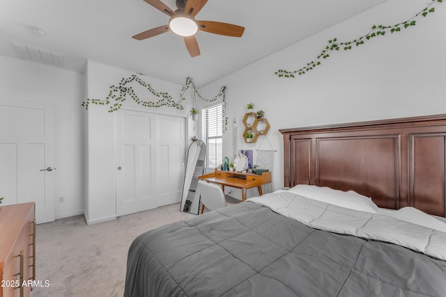 bedroom featuring light carpet, a closet, and ceiling fan