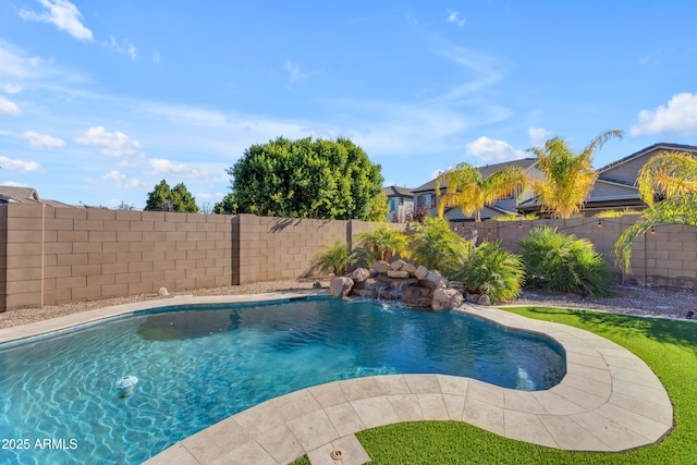 view of swimming pool with pool water feature