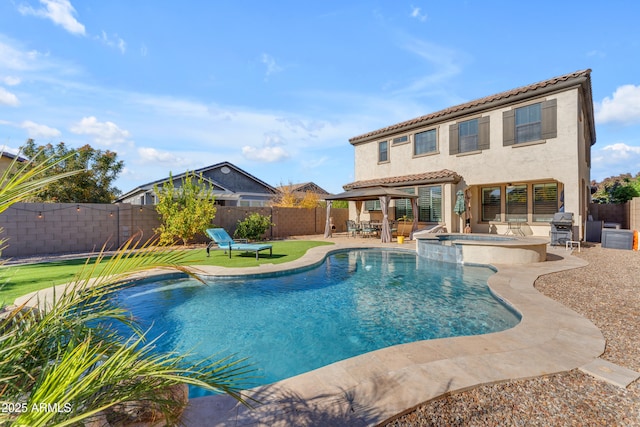 view of swimming pool with an in ground hot tub, grilling area, and a patio area