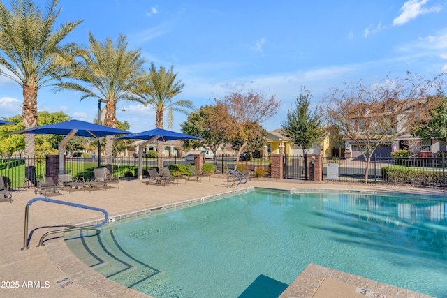 view of swimming pool featuring a patio area