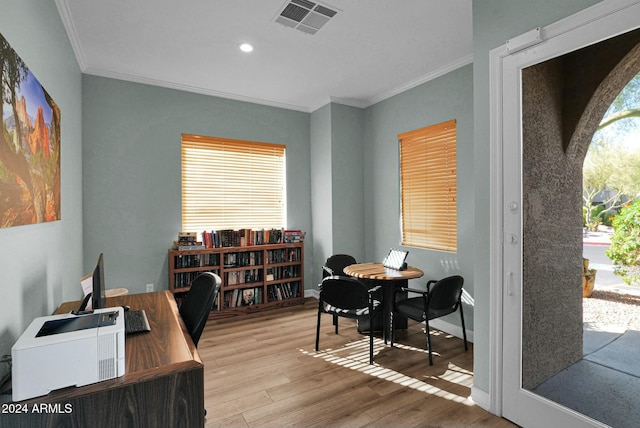 office area featuring light hardwood / wood-style flooring and ornamental molding