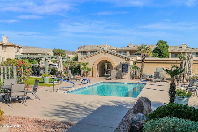 view of swimming pool with a pergola and a patio area