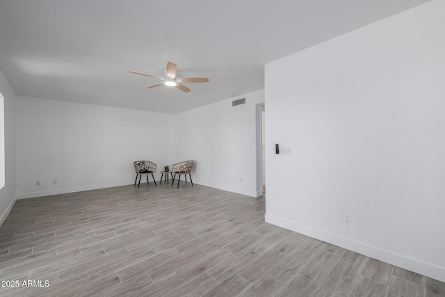 8478 W Grovers Ave, Peoria, AZ 85382 - empty room featuring light wood-style flooring and a ceiling fan