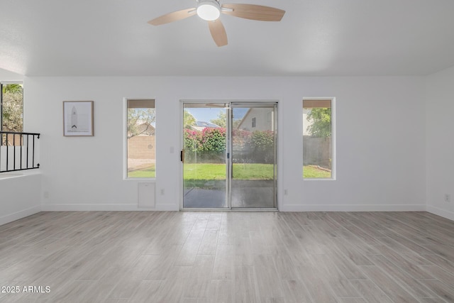 8478 W Grovers Ave, Peoria, AZ 85382 - spare room featuring a ceiling fan, light wood-type flooring, and plenty of natural light
