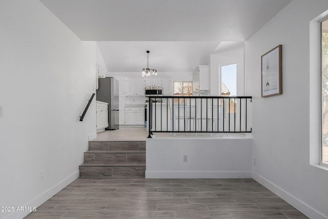 8478 W Grovers Ave, Peoria, AZ 85382 - stairs featuring a chandelier and wood finish floors