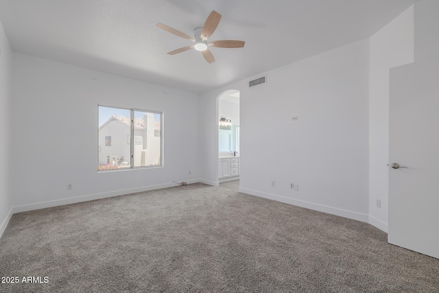 8478 W Grovers Ave, Peoria, AZ 85382 - carpeted empty room with ceiling fan and arched walkways