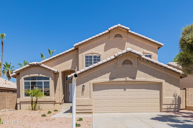 8478 W Grovers Ave, Peoria, AZ 85382 - mediterranean / spanish house featuring a tile roof, an attached garage, concrete driveway, and stucco siding