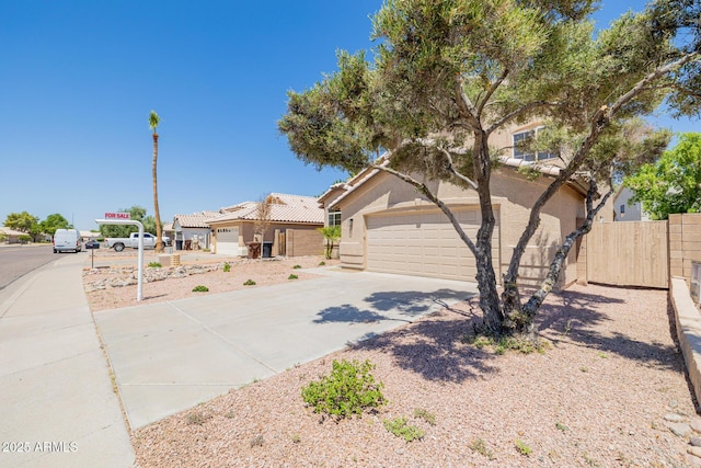 8478 W Grovers Ave, Peoria, AZ 85382 - view of front of home with concrete driveway, an attached garage, a tiled roof, and stucco siding
