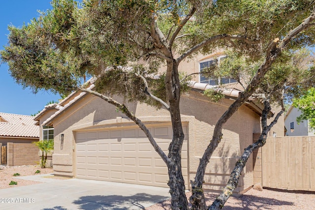 8478 W Grovers Ave, Peoria, AZ 85382 - view of front facade featuring stucco siding, driveway, and a tiled roof