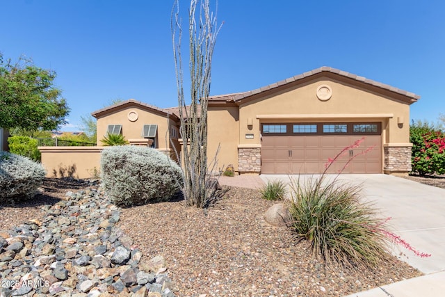 29159 N 128th Ln, Peoria, AZ 85383 - view of front of house featuring stucco siding, concrete driveway, stone siding, and an attached garage