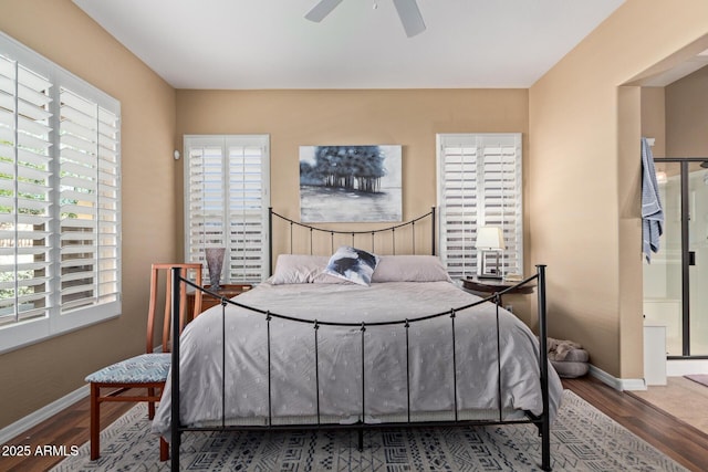 29159 N 128th Ln, Peoria, AZ 85383 - bedroom featuring multiple windows, wood finished floors, baseboards, and ceiling fan