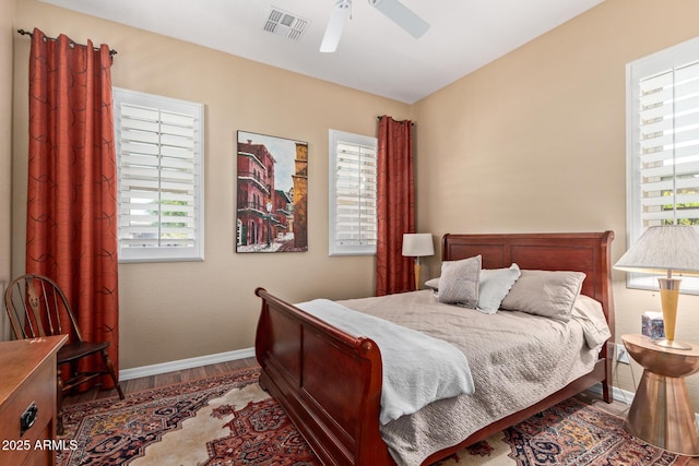 29159 N 128th Ln, Peoria, AZ 85383 - bedroom with wood finished floors, baseboards, multiple windows, and ceiling fan
