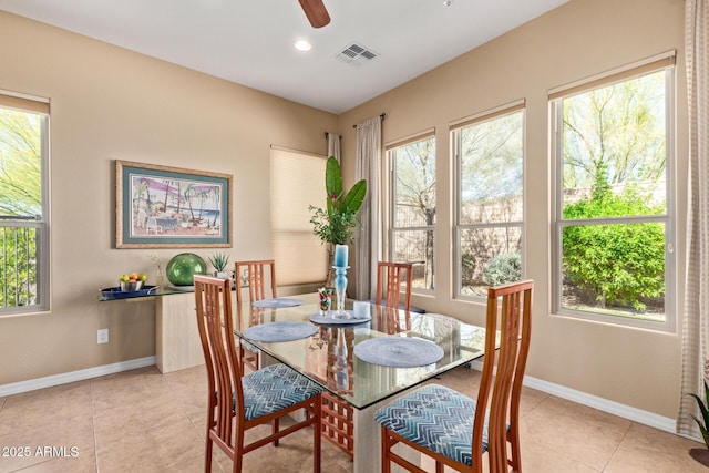 29159 N 128th Ln, Peoria, AZ 85383 - dining room with healthy amount of natural light, baseboards, and ceiling fan