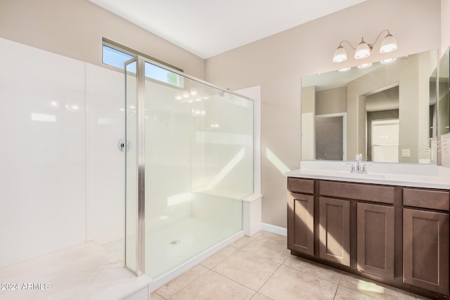 bathroom with vanity, tile patterned flooring, and a shower with door