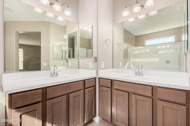 bathroom featuring an enclosed shower and vanity