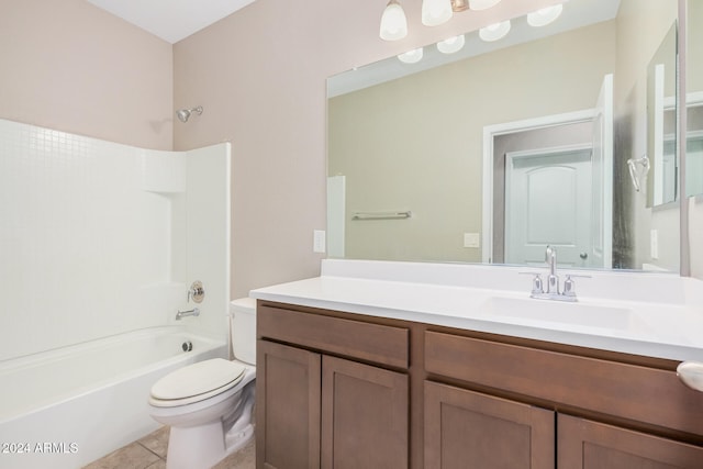 full bathroom featuring toilet, vanity, tile patterned flooring, and shower / washtub combination