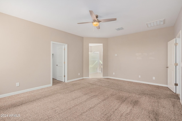 unfurnished room featuring ceiling fan and light colored carpet