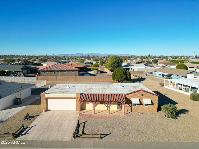 birds eye view of property with a mountain view