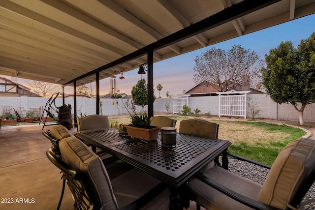 view of patio terrace at dusk