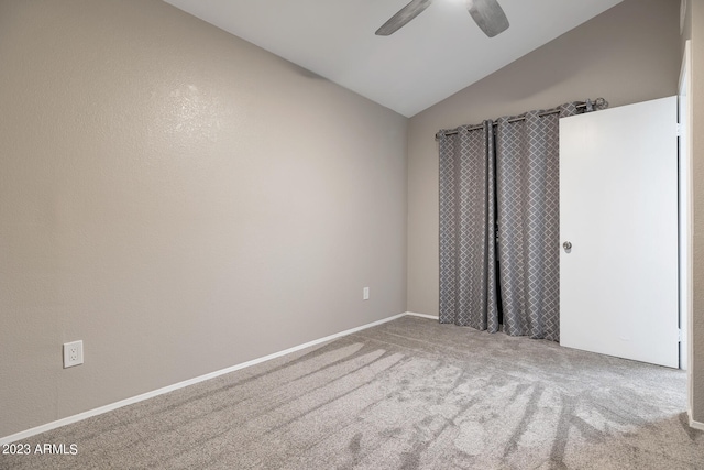 unfurnished room featuring ceiling fan, lofted ceiling, and light carpet