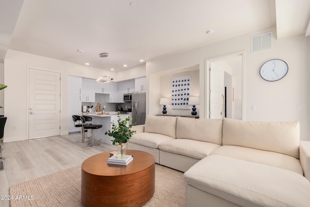 living room featuring light wood-type flooring