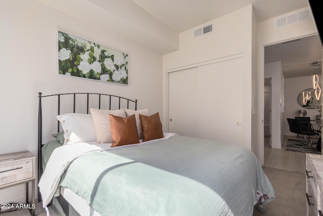 carpeted bedroom featuring a closet