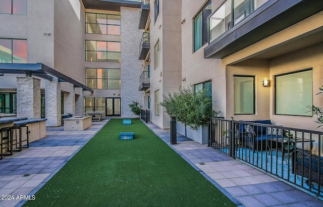 surrounding community featuring a patio area