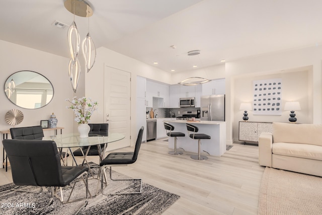 dining room featuring light hardwood / wood-style floors