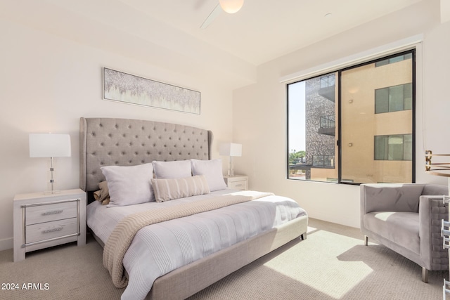 bedroom featuring ceiling fan and carpet