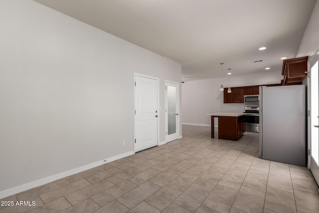2000 N 36th St Unit 10, Phoenix, AZ 85008 - kitchen featuring stainless steel appliances, light countertops, recessed lighting, a kitchen island, and hanging light fixtures