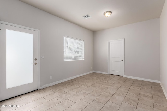 2000 N 36th St Unit 10, Phoenix, AZ 85008 - unfurnished room with light tile patterned floors and baseboards