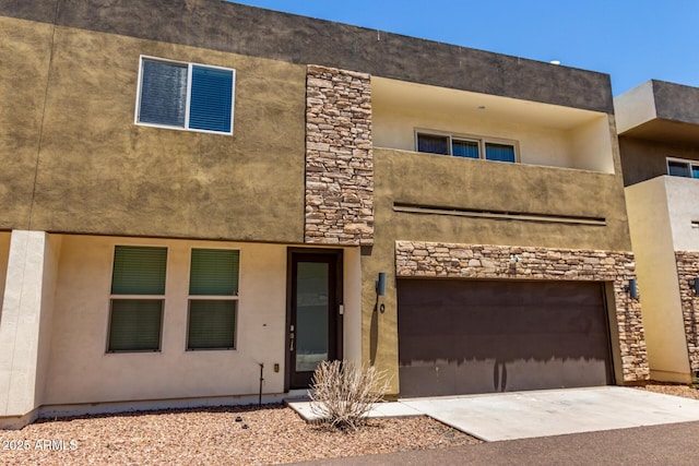 2000 N 36th St Unit 10, Phoenix, AZ 85008 - view of front facade with an attached garage, concrete driveway, stone siding, and stucco siding