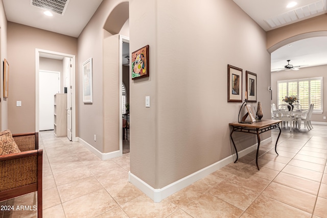 corridor with light tile patterned flooring