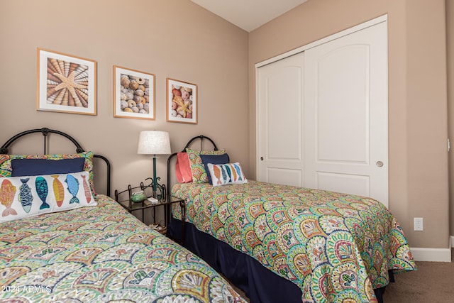 bedroom with a closet and carpet floors