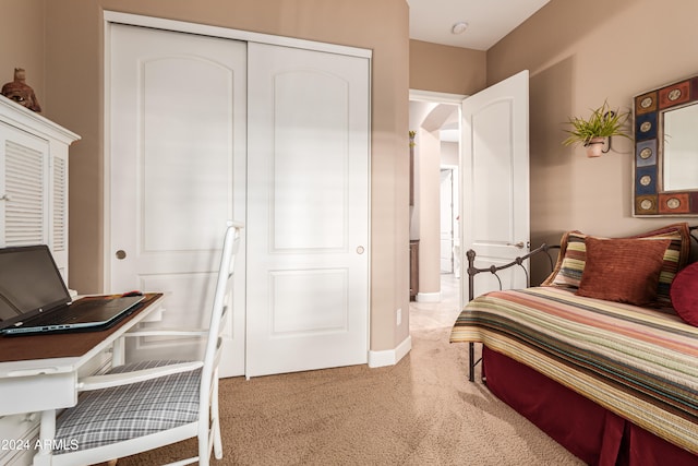 carpeted bedroom with a closet