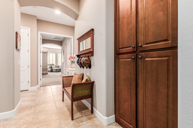 hallway with light tile patterned floors