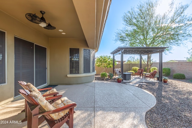 view of patio / terrace with ceiling fan and a pergola