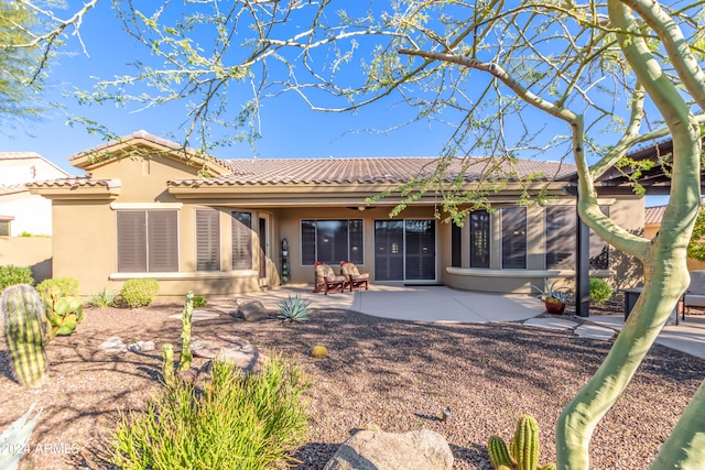 back of property featuring a patio