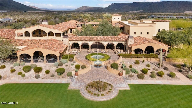 exterior space featuring a mountain view and a yard