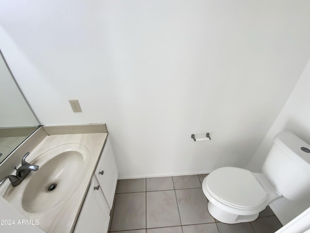 bathroom with tile patterned floors, vanity, and toilet