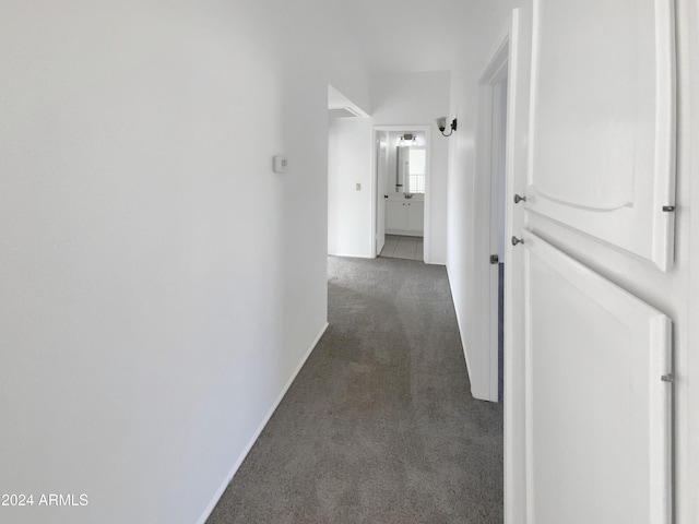 hallway with dark carpet