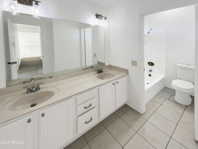 full bathroom with tile patterned floors, vanity,  shower combination, and toilet